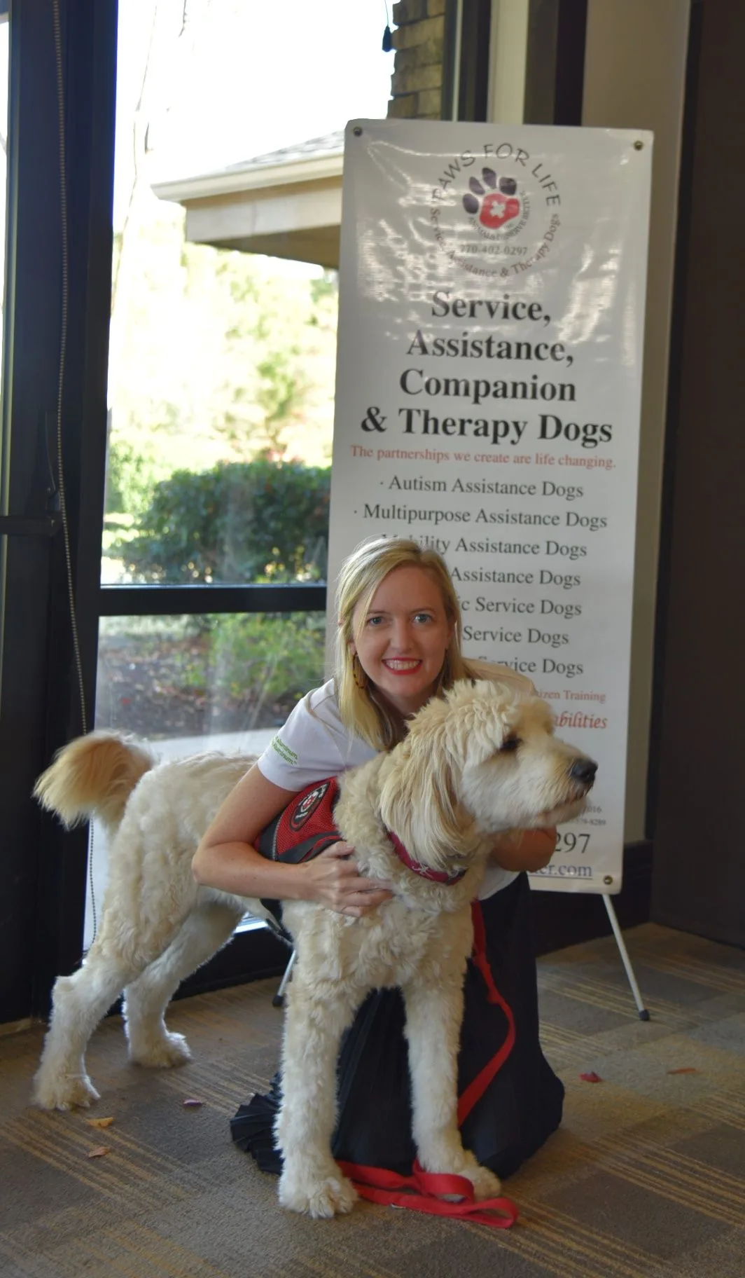 Guest with a dog at an Outer Circle Foundation community event