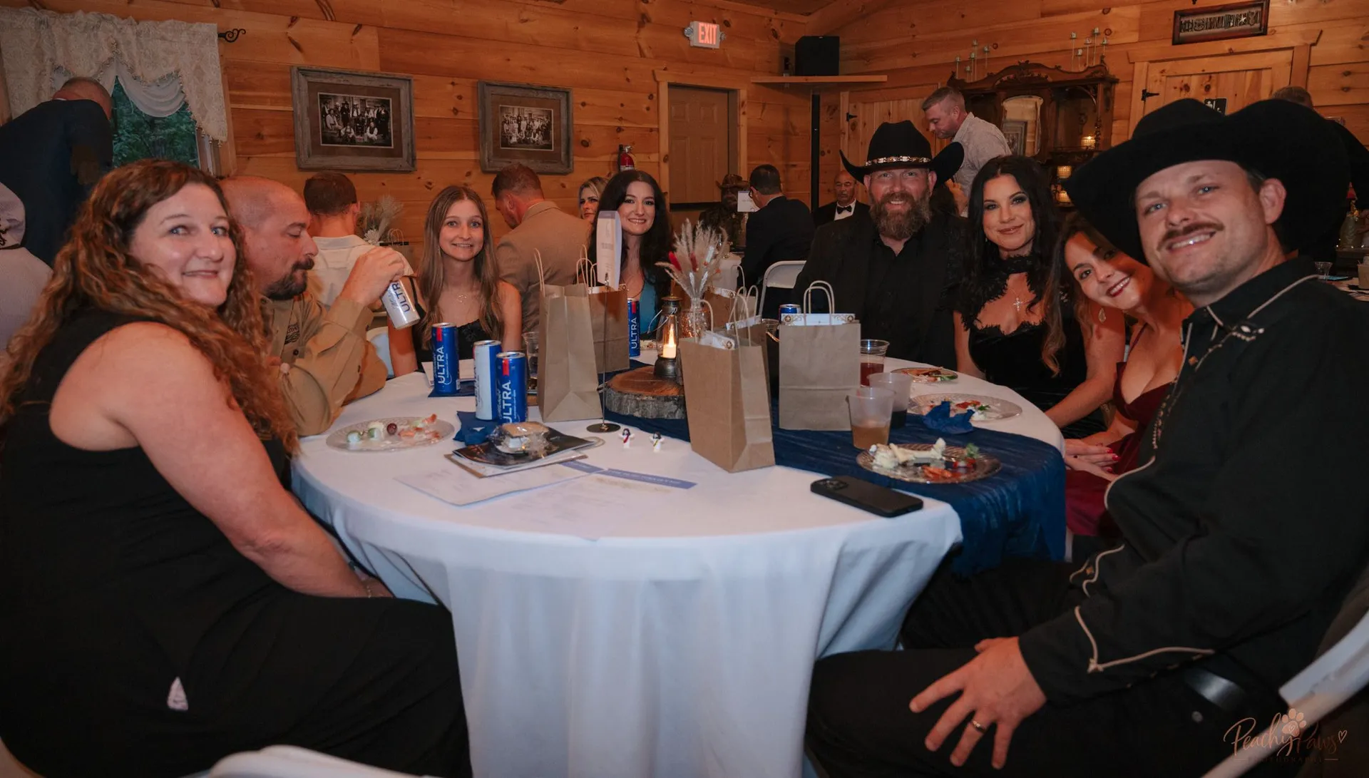 Gala guests gathered together around a table at the Blue Jean Ball